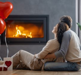 Couple in front of fireplace on Valentine's Day