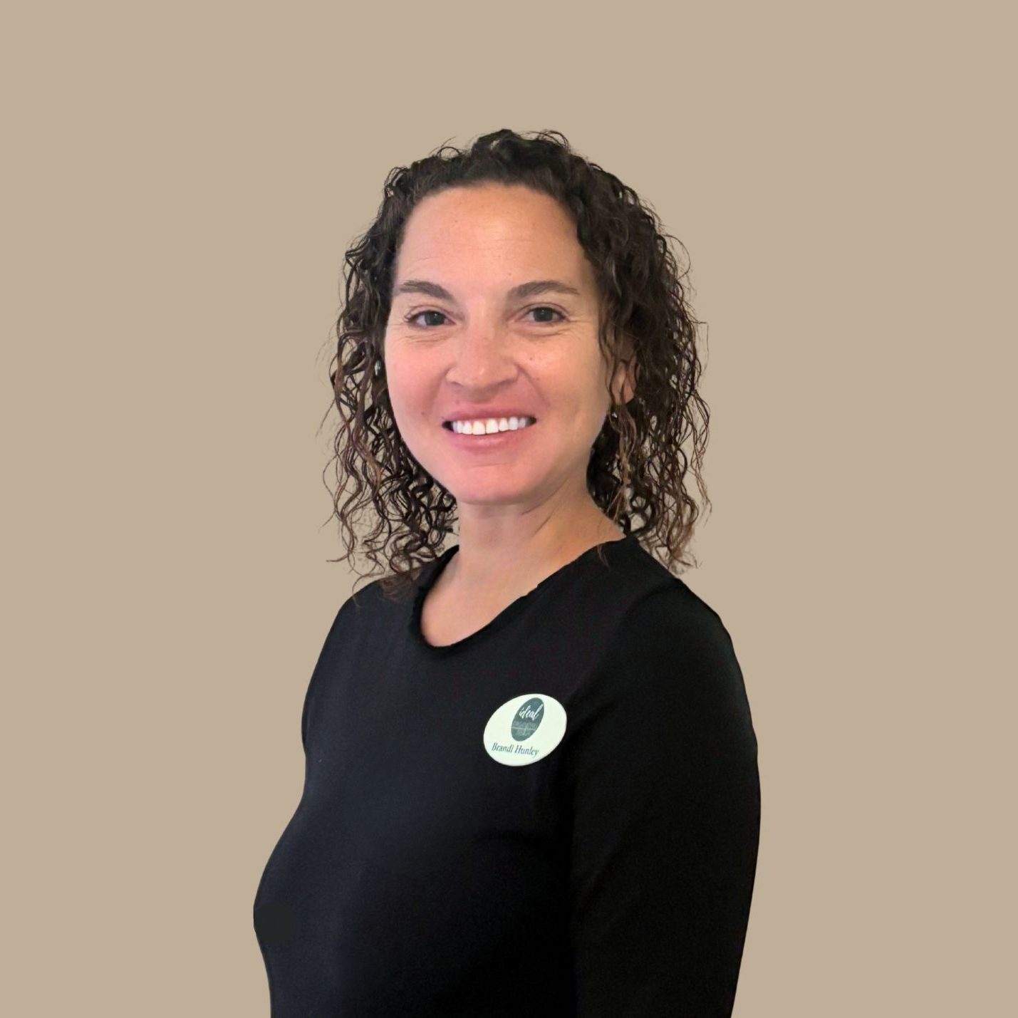 Brandi Beige Social media specialist Brandi Hunley in black shirt and name tag